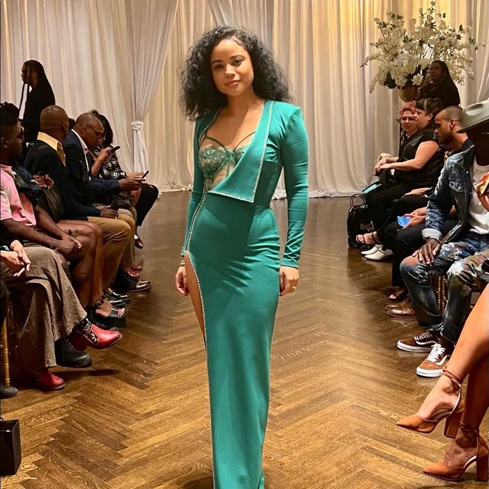 Such a show stopper green dress with rhinestones in great condition.